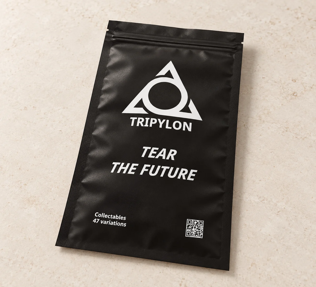 TriPylon Touch in its sealed black foil pouch, shown as a studio concept image